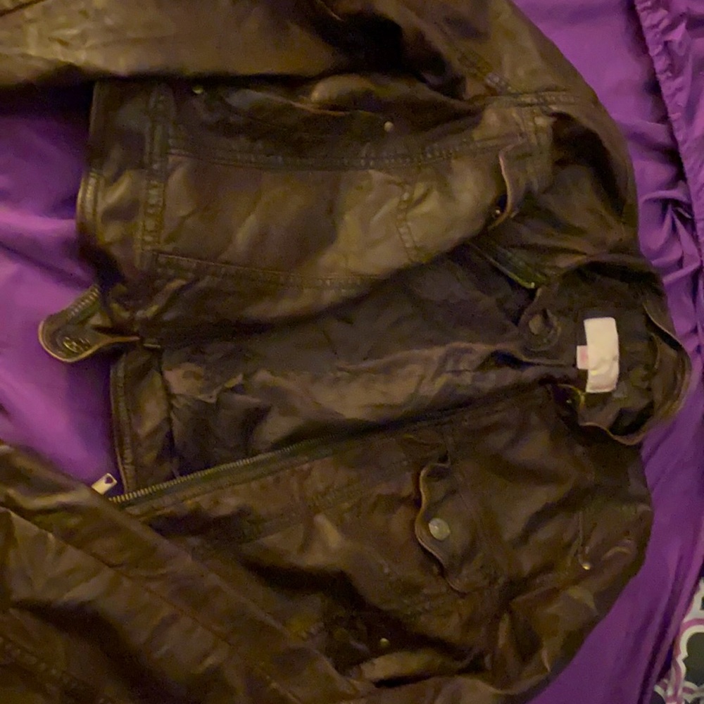 A medium sized brown leather jacket
